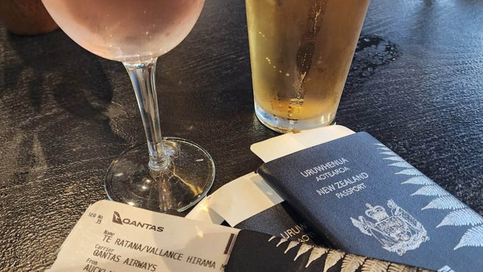 New Zealand passport and a Qantas boarding pass